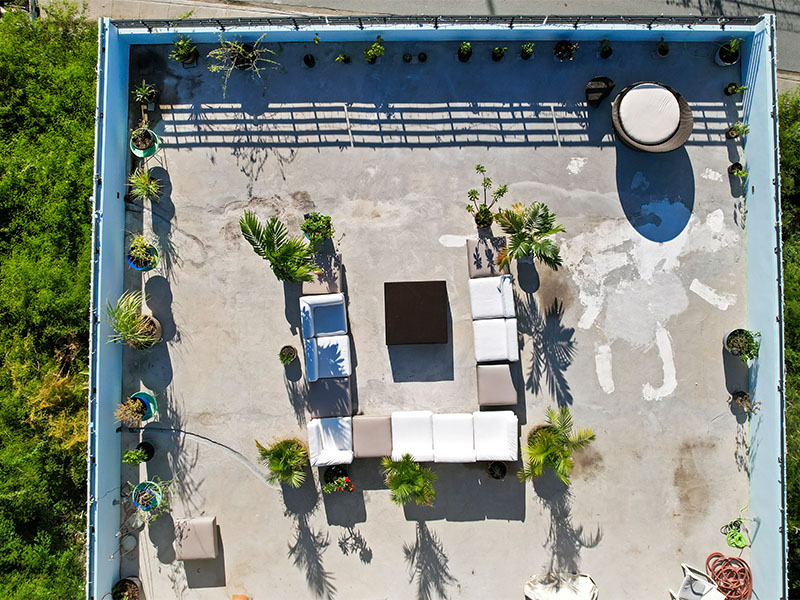 Aerial view of rooftop deck with seating area and plunge pool